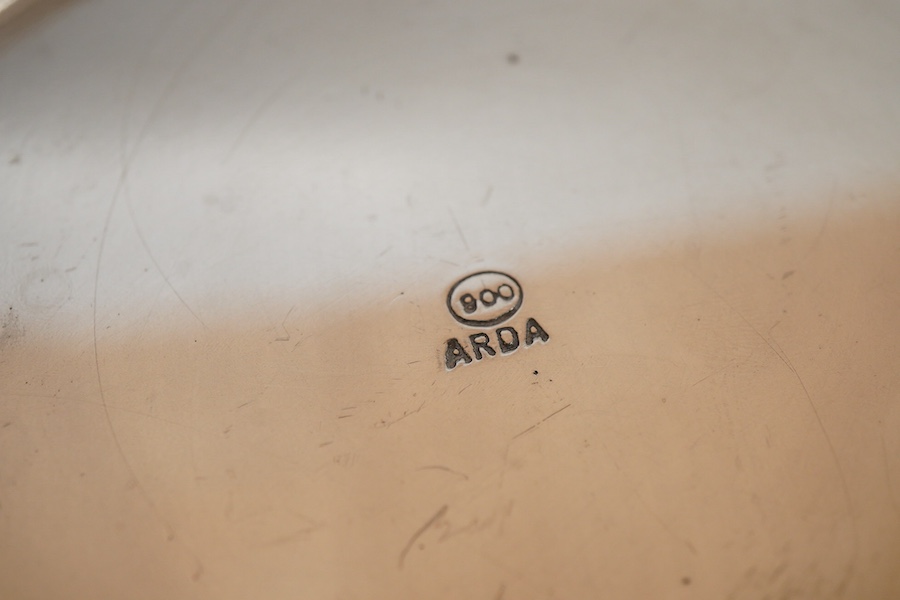 An Italian pierced 900 standard white metal bottle coaster, diameter 99mm, together with a sterling cream jug and a small 925 bowl, 9.9oz.